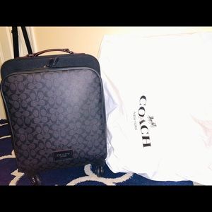 Coach black carry-on luggage
